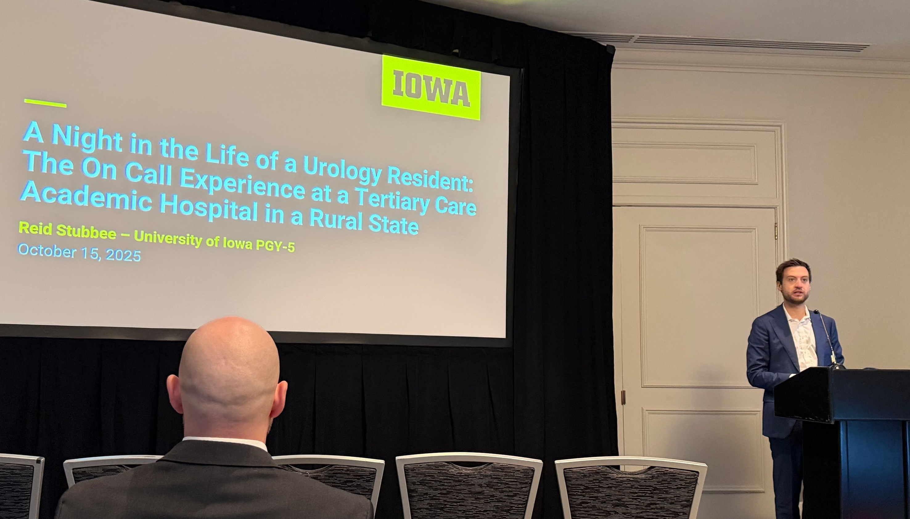 Dr. Reid Stubbee delivering a podium presentation at NCS